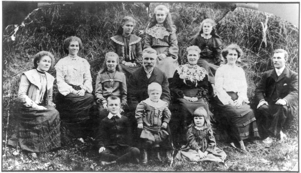 The Keymer family in 1904 -- Back row: Edith, Laura, Alice -- Middle row: Eliza, Louie, Bertha, Parents, Ada, William -- Front row: George, Hector, Dorothy